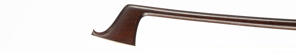 The head of a W. E. Hill & Sons violin bow in profile